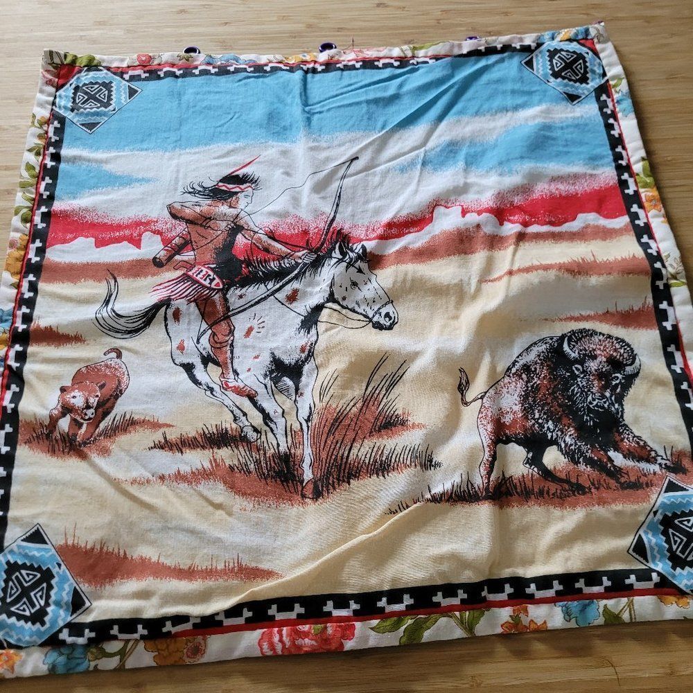 Vintage Native Fabric with hooks for display.